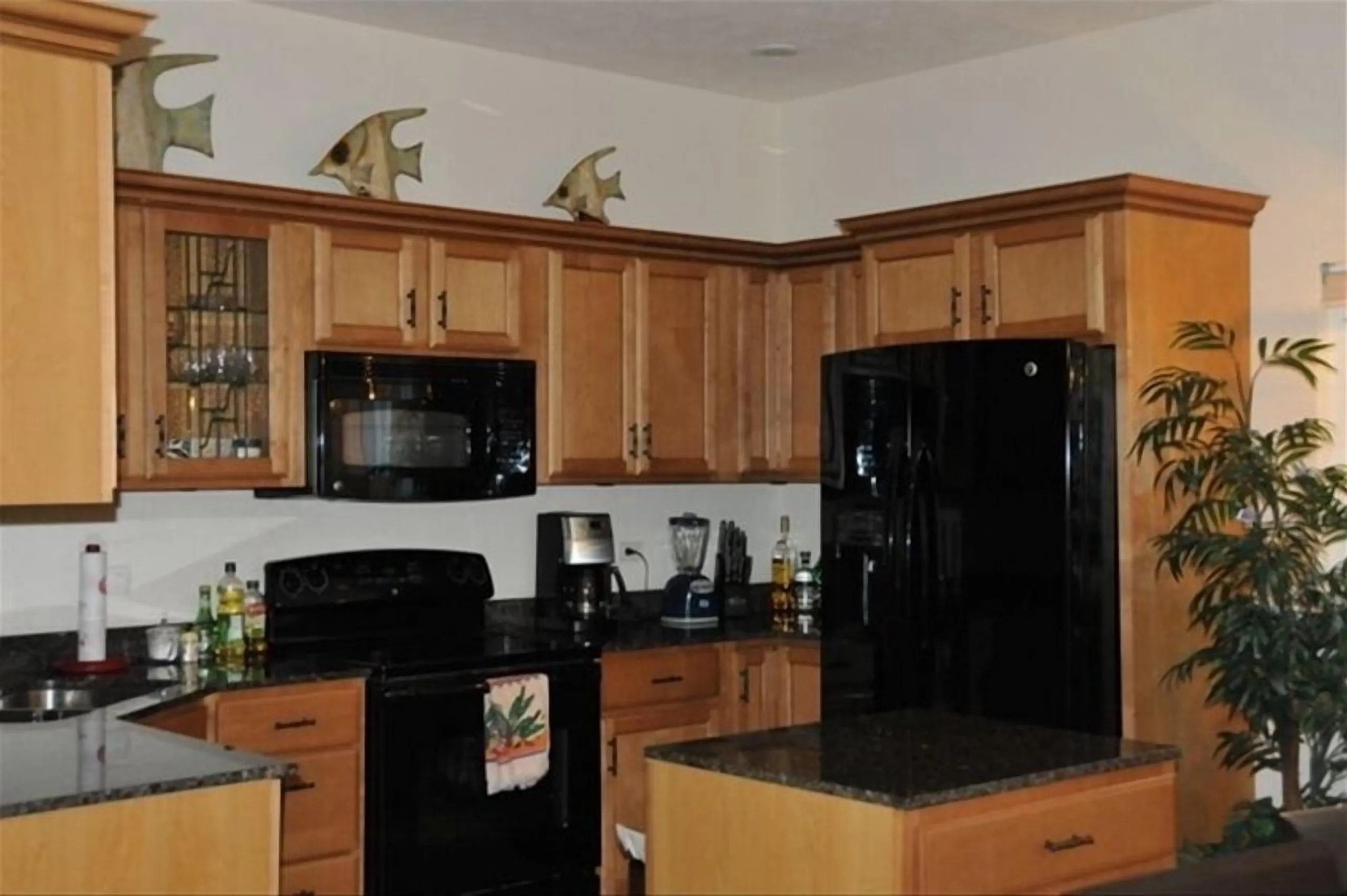 Counter with coffee maker, microwave and wooden cabinets in the Casa Dana kitchen